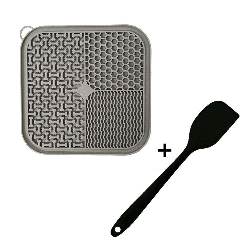 Tapis de léchage gris et spatule noire